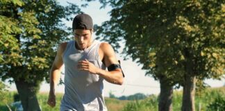 Man running on a tree-lined path