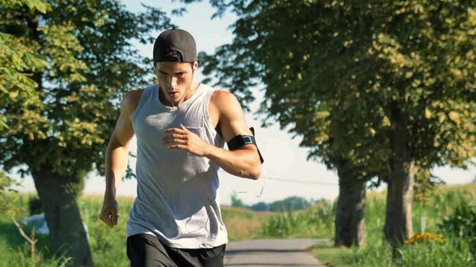 Man running on a tree-lined path