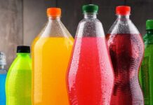 Assorted colorful plastic beverage bottles with condensation